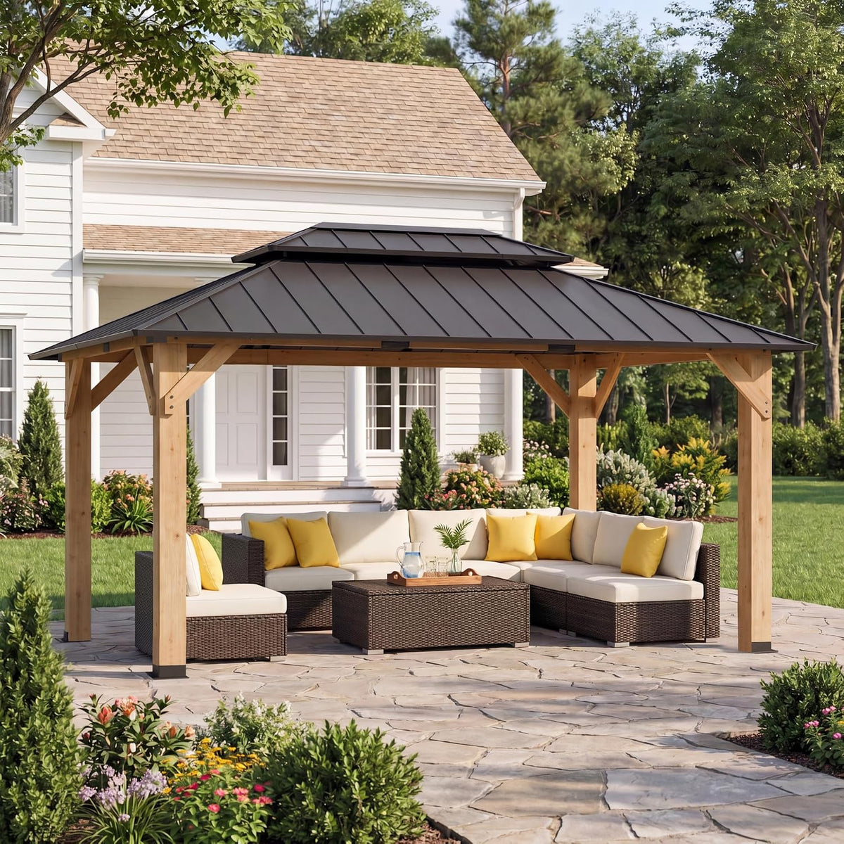 Wood gazebo with dark metal roof over wicker sectional seating on a stone patio, angled exterior view
