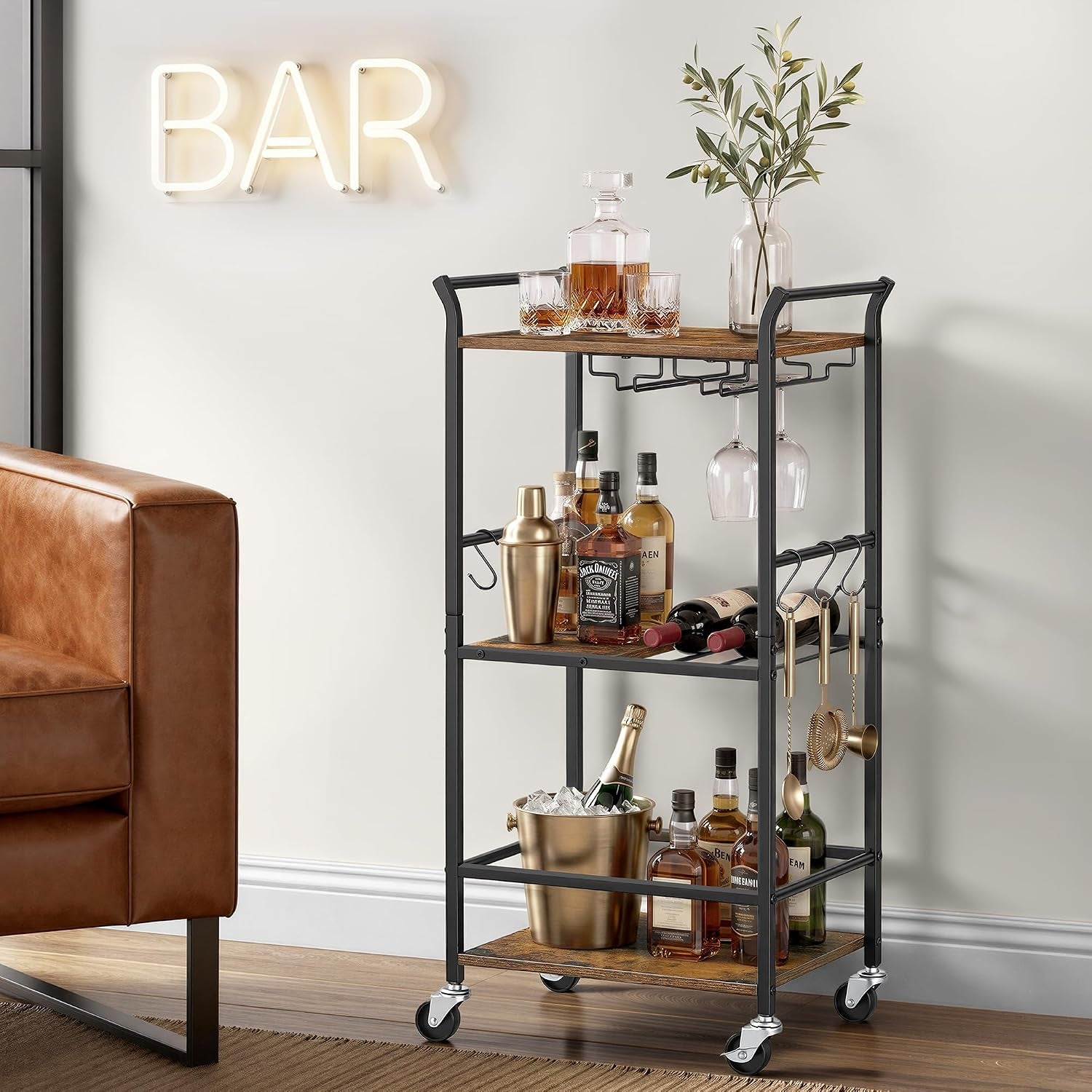 Side view of the bar cart showing hanging bar tools on the frame and a bucket of ice on the bottom shelf.