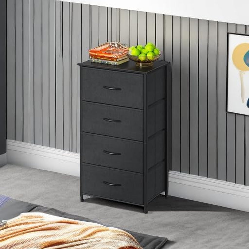 Black 4-drawer dresser placed against a paneled bedroom wall