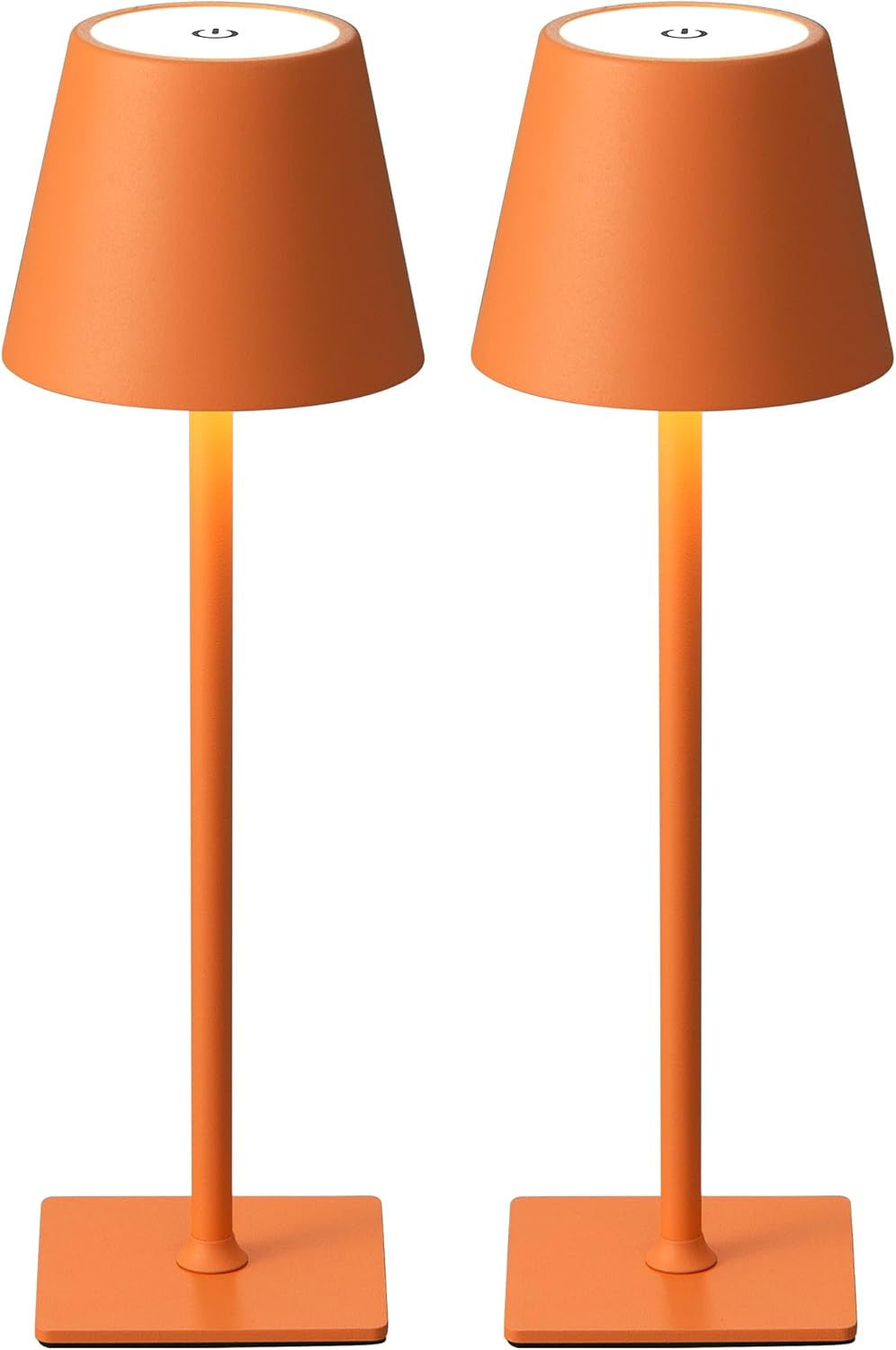 Two orange cordless table lamps side-by-side with a soft warm glow under the shades.