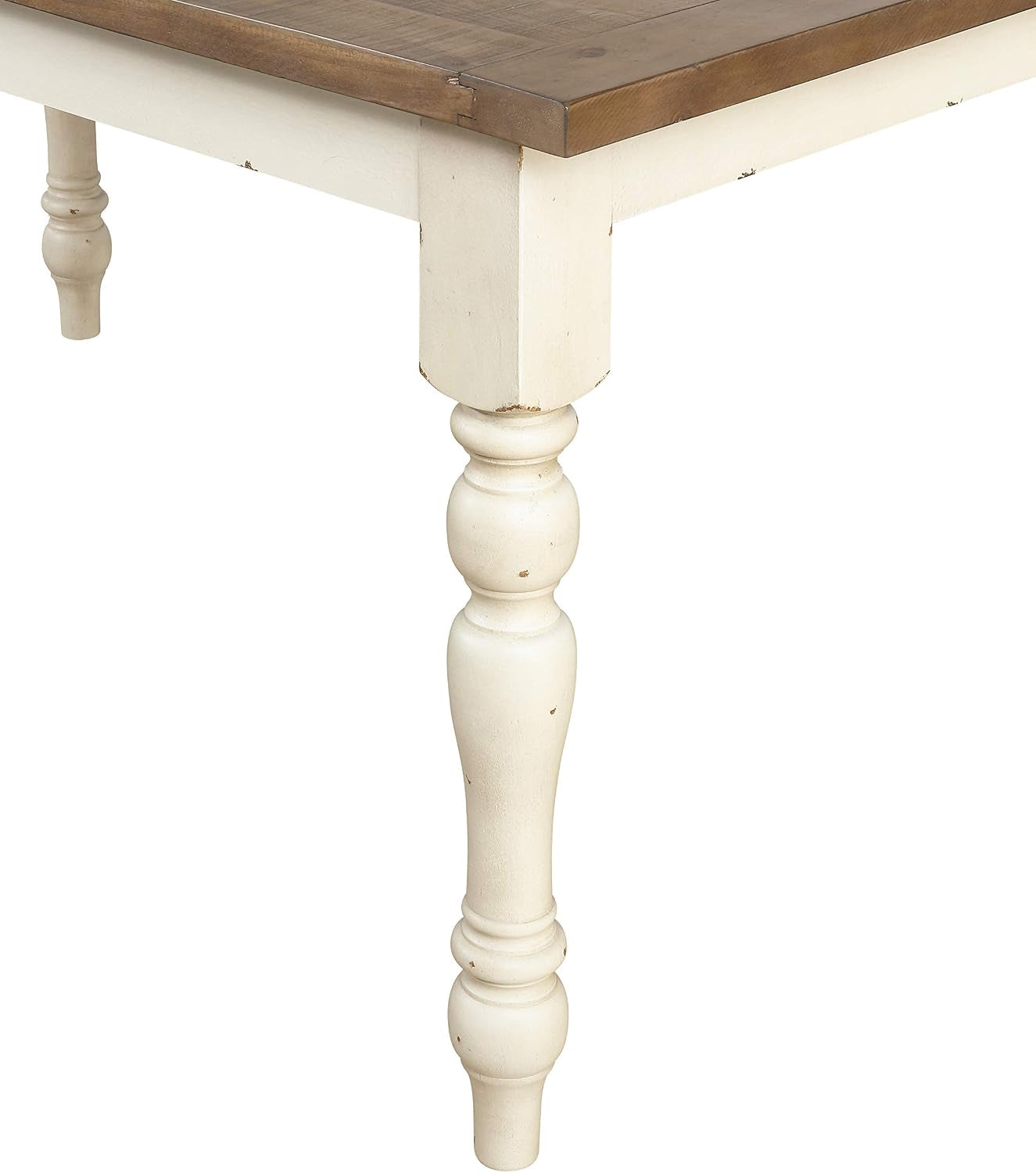 Turned powder-coated antique white table leg detail with subtle distressing on the finish