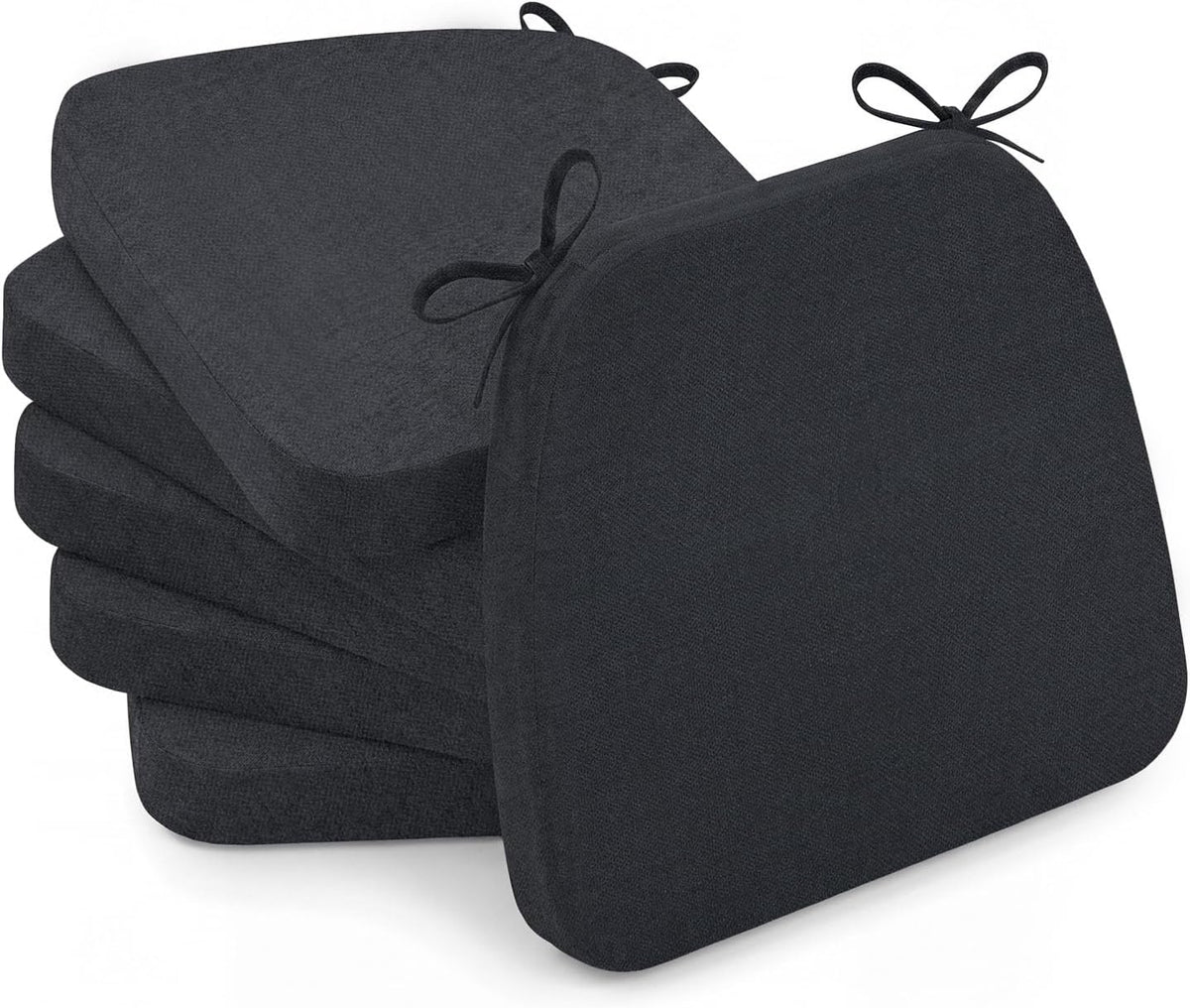 Three-quarter angled view of four dark charcoal D-shaped chair cushions stacked, front cushion tilted forward.