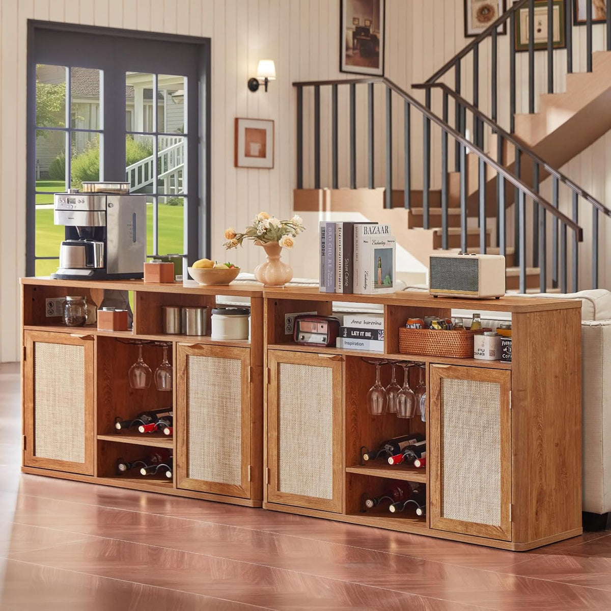 Two matching cabinets placed behind a sofa in a bright living room, topped with decor and a coffee maker.