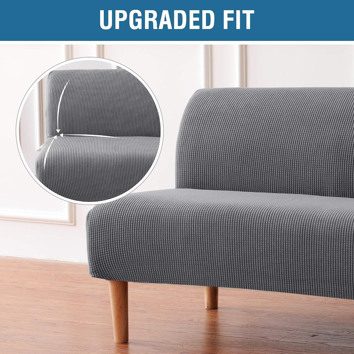 Close-up of grey slipcover corner showing small-check texture and a fitted seam at the back-and-seat junction