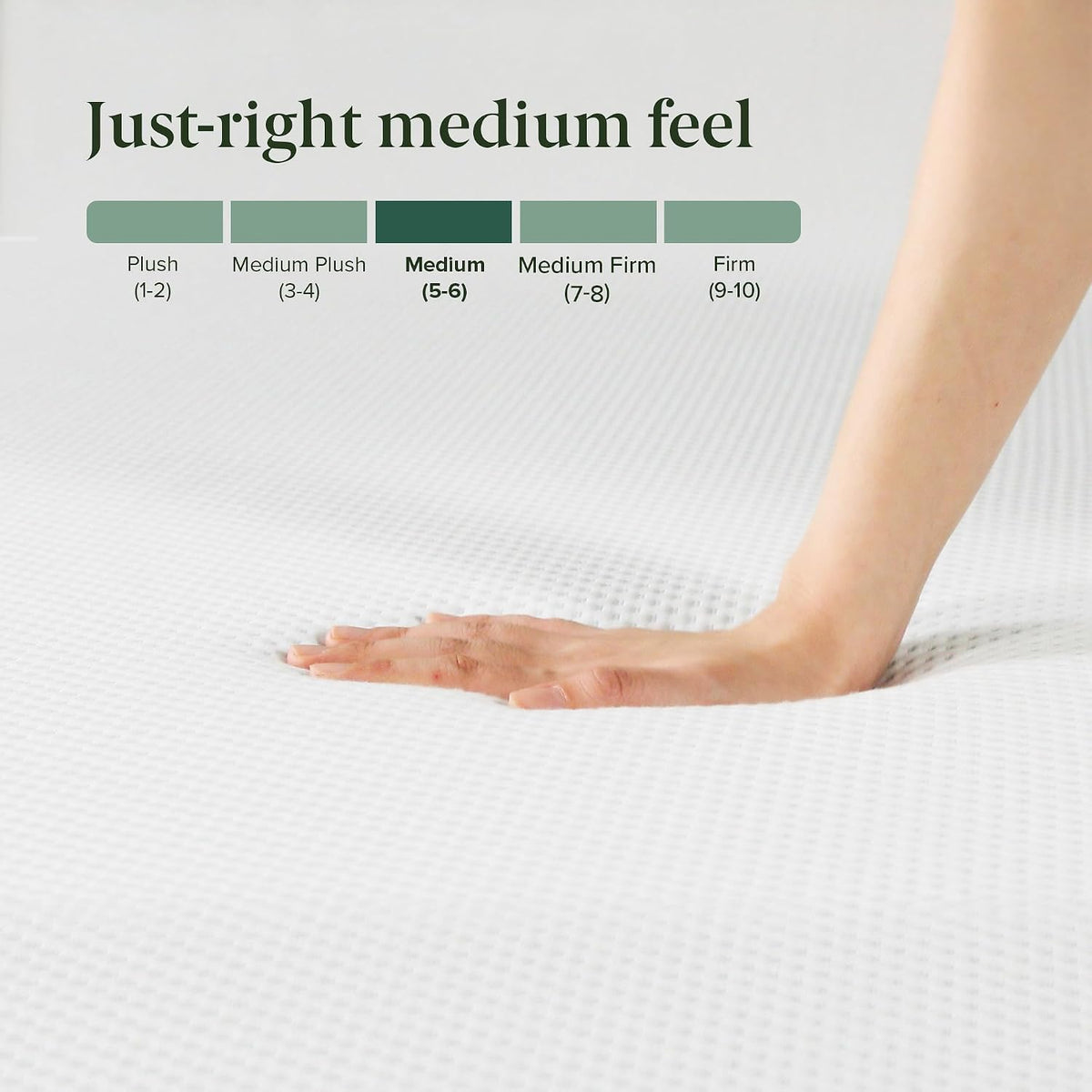 Hand pressing the mattress surface to demonstrate its medium (5–6) feel on a textured white cover, close-up.