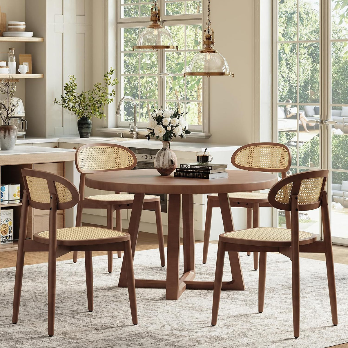 Walnut finish armless rattan dining chairs around a round wood table in a bright kitchen setting
