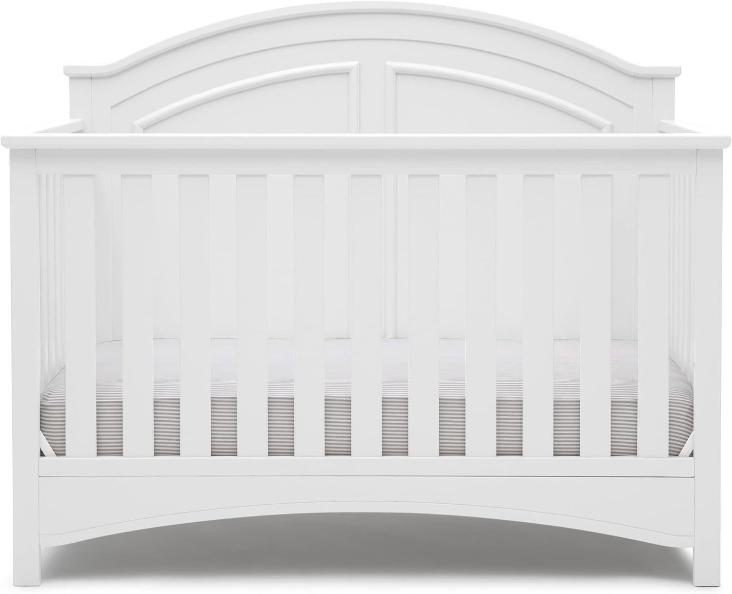 Front view of a white wooden convertible crib showing slatted front and arched headboard.