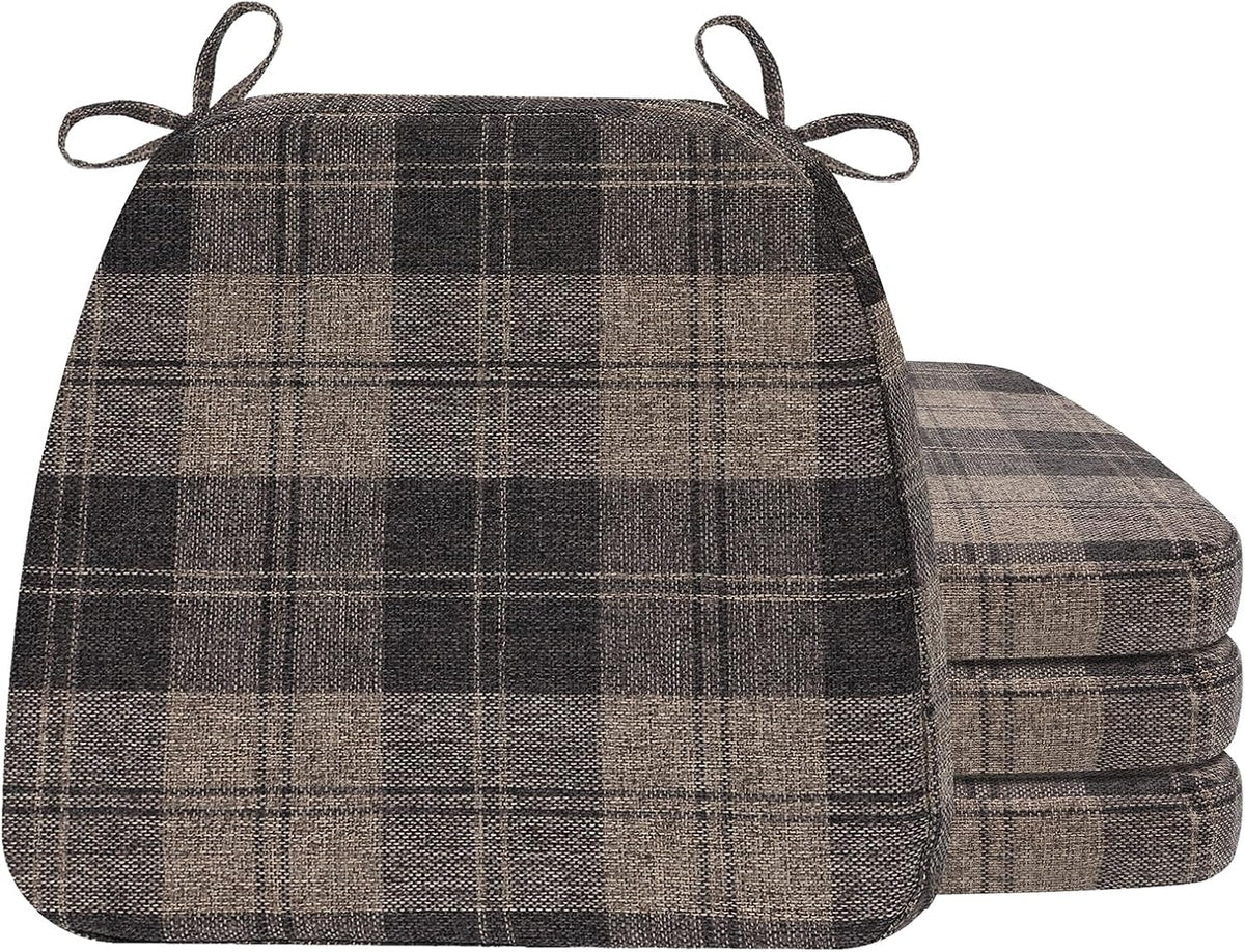 Single dark plaid D-shaped cushion shown front-on with three matching cushions stacked beside it