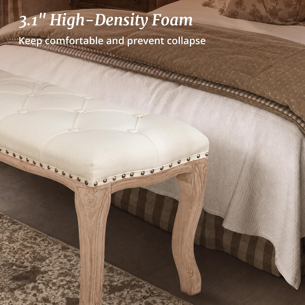Close-up of bench corner showing linen upholstery, button diamond tufting and a carved wooden leg