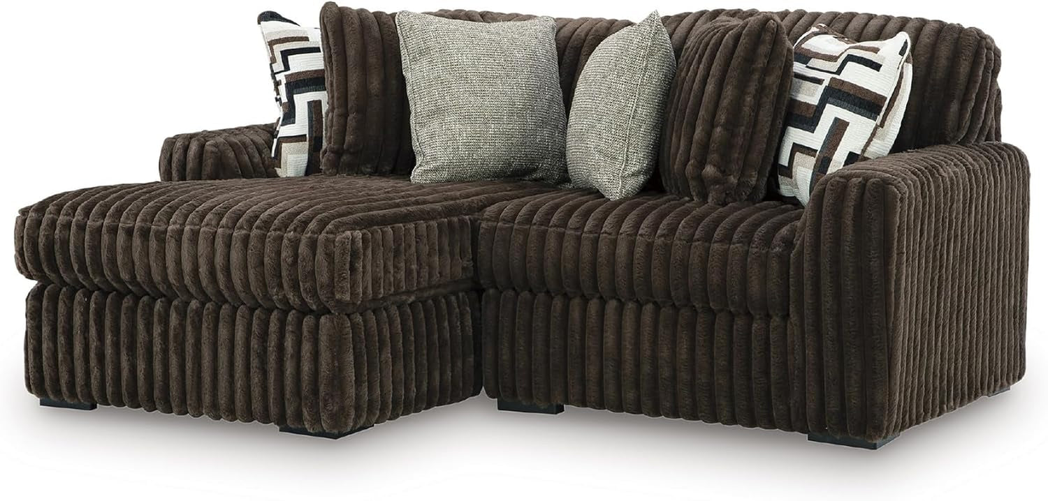 Oversized chocolate-brown corduroy chaise sectional with left chaise and three throw pillows