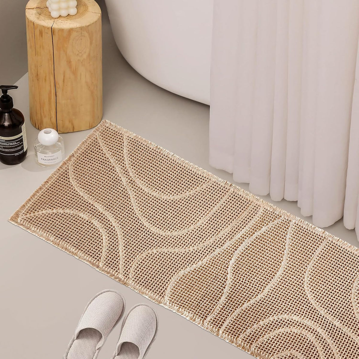 Beige wavy-textured rectangular mat on a bathroom floor beside a tub and slippers.