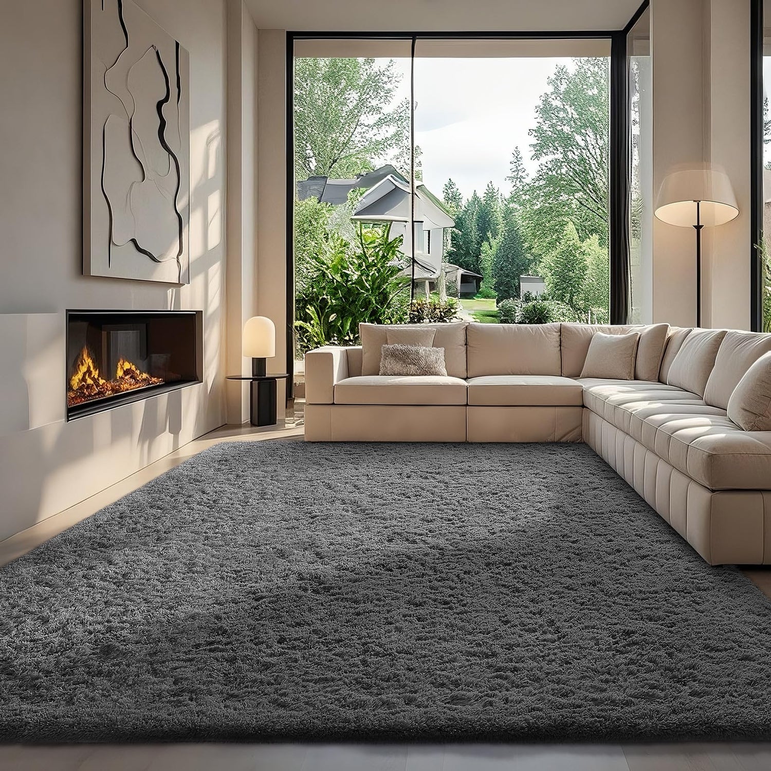 Bright modern living area with large windows, a cream L-shaped sofa and a charcoal shag rug