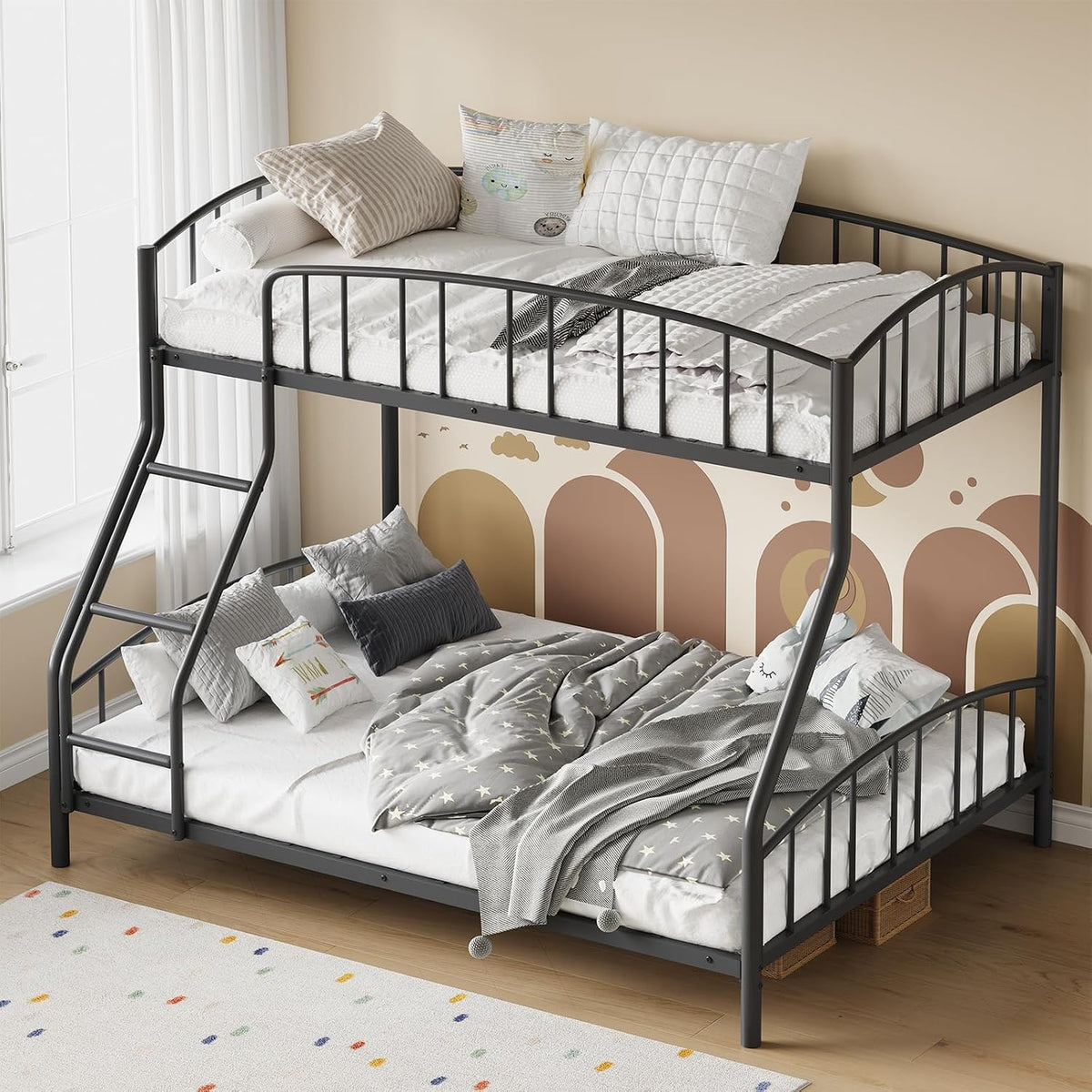 Angled shot of the twin-over-full metal bunk bed showing curved guardrails and slatted frames.