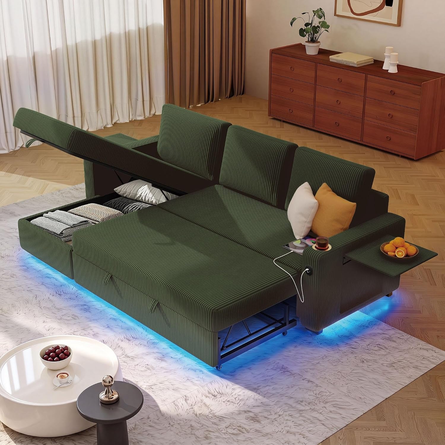 Green corduroy sectional sleeper with blue LED lighting glowing underneath and open storage
