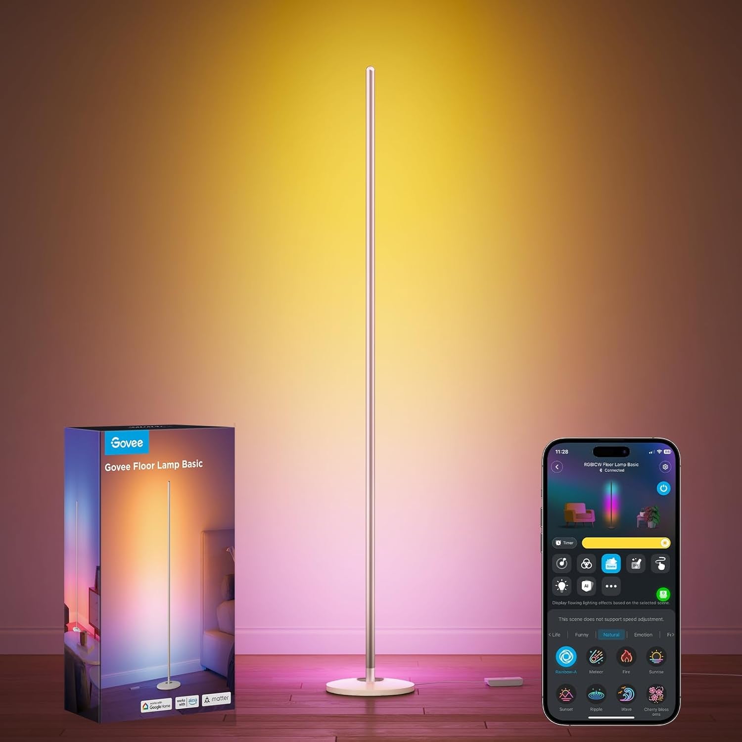 Slim floor lamp glowing warm gold and pink against a wall, packaging box at left and smartphone showing the control app at
