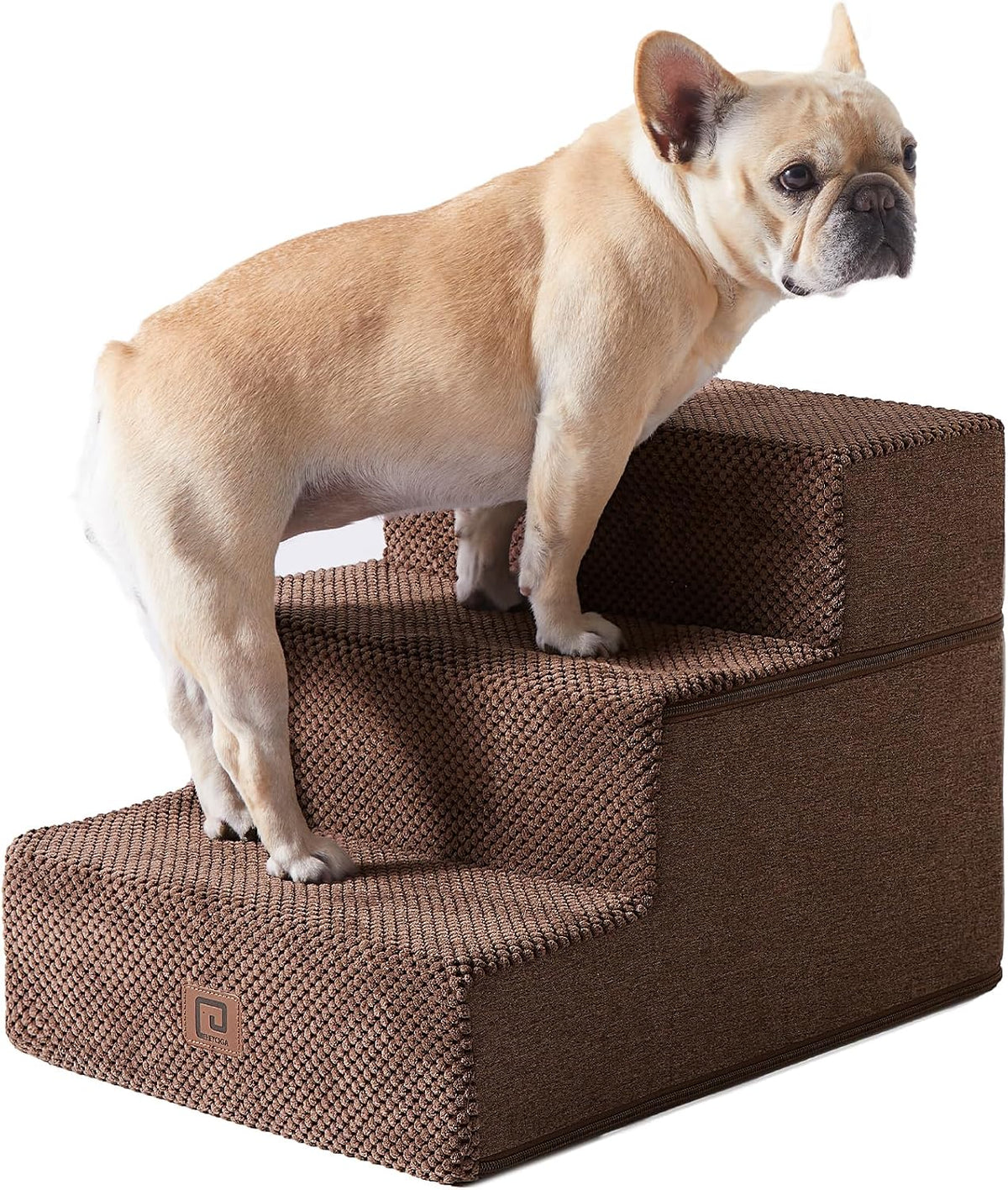 Side crop of a fawn French bulldog with a built-in carry handle visible through the middle step of brown stairs.