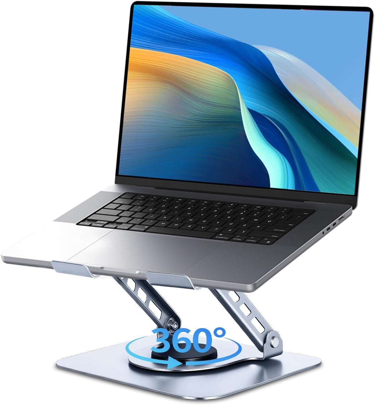 Angled view of a silver adjustable aluminum laptop stand holding a laptop, showing its swivel base and raised front lip.