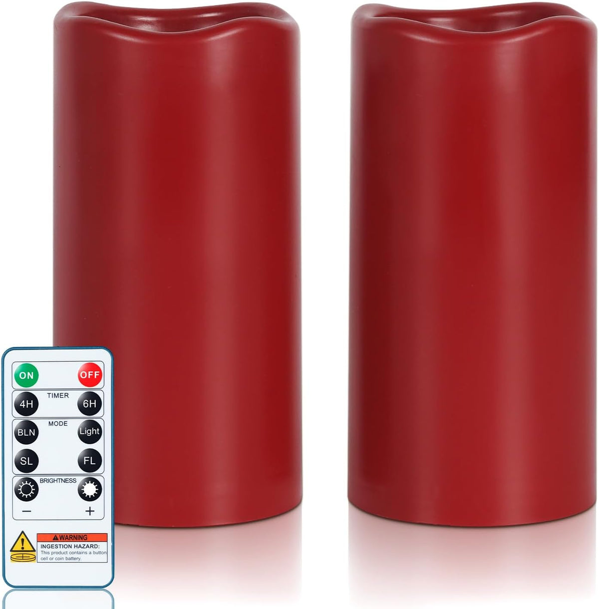 Two tall red pillar candles standing side-by-side with a remote control visible at the lower left.