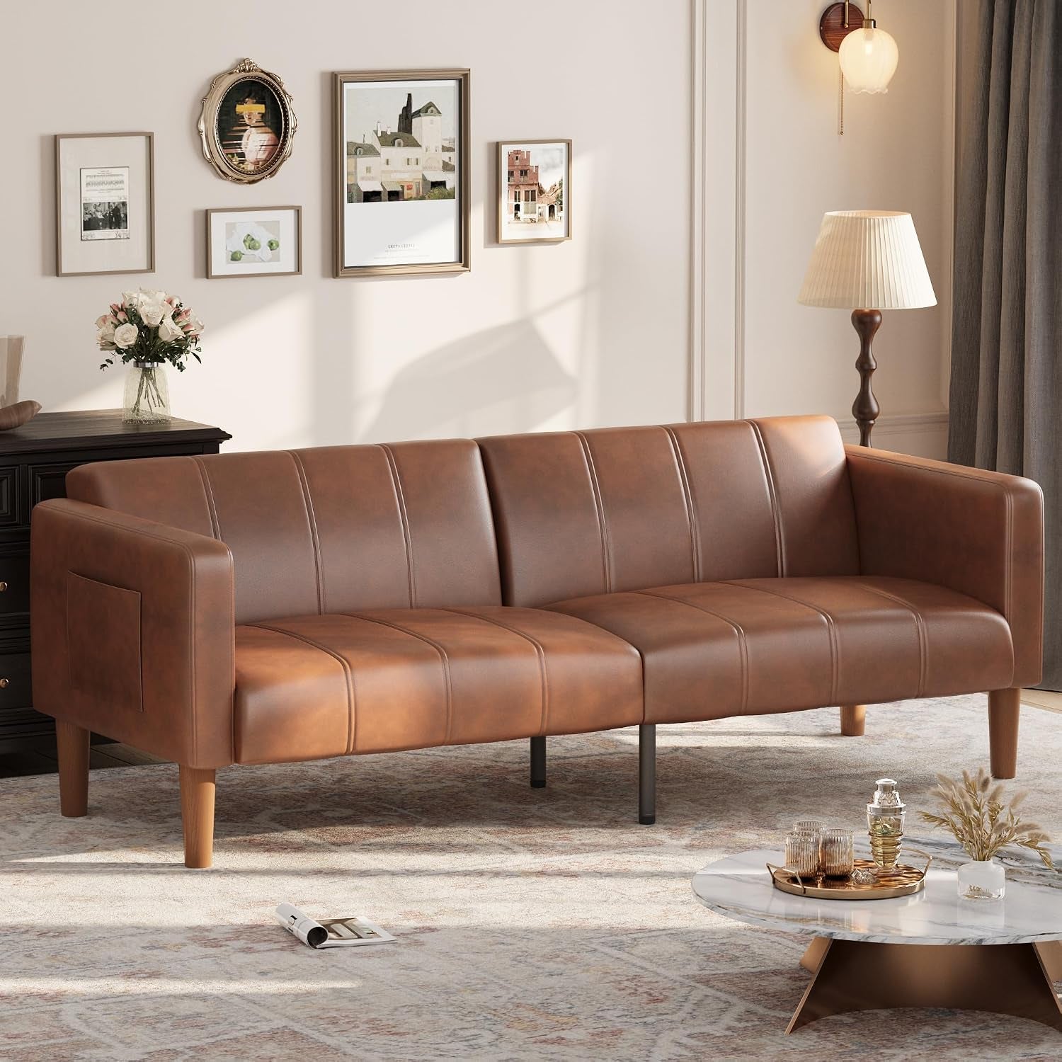 Brown faux leather futon sofa angled front view in a living room setting