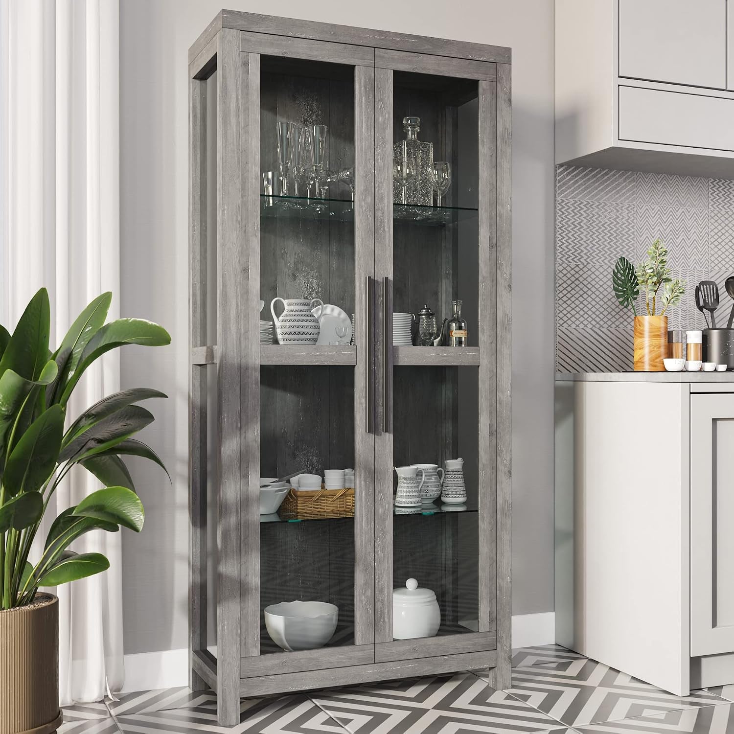Tall gray wash display cabinet in a kitchen vignette, angled front view with dishware on glass shelves