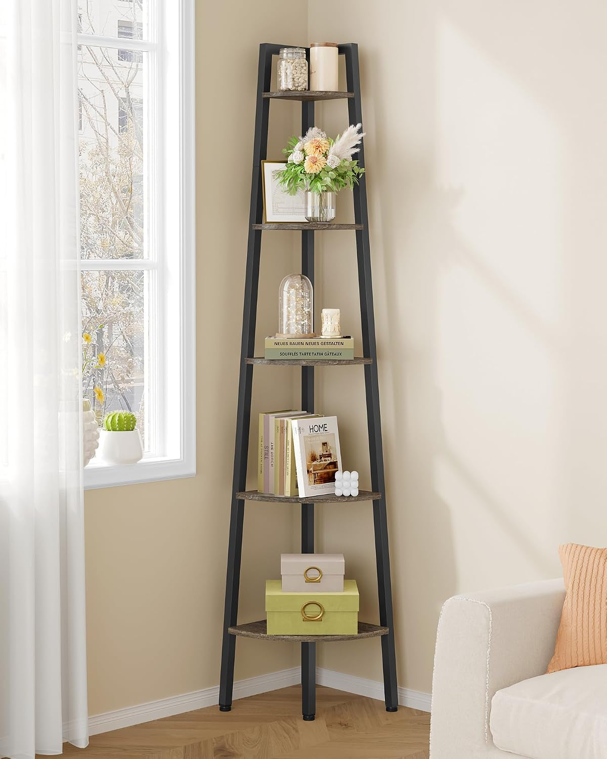Angled view of black corner shelf with floral arrangement and decorative jars on upper tiers