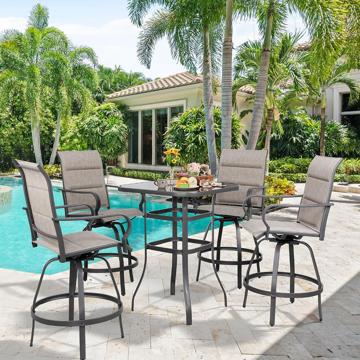 Taupe-textilene swivel bar chairs arranged around a tempered glass-top table at a poolside patio, angled front view