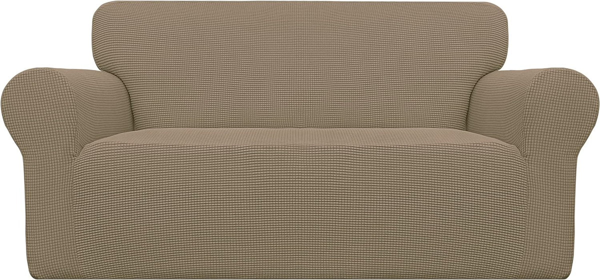 Front view of a loveseat with a waffle-texture taupe slipcover fitted over cushions and arms.