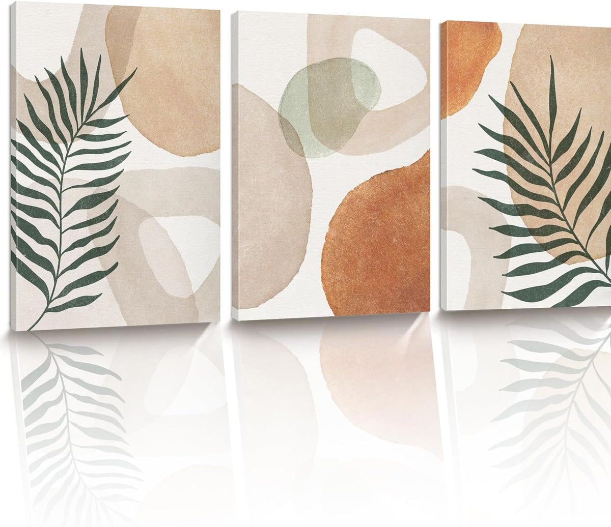 Three canvases shown at a slight angle, leaf silhouettes on left and right with large warm-toned circles in center.