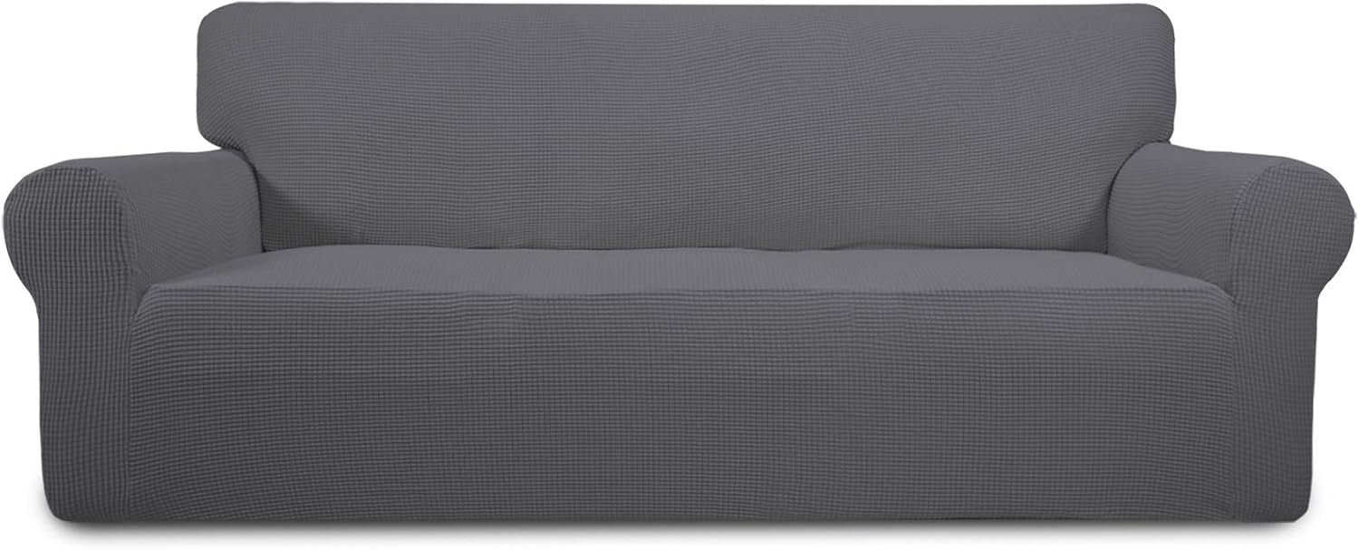Full-width front view of a long sofa dressed in a medium charcoal-gray textured slipcover on white background.