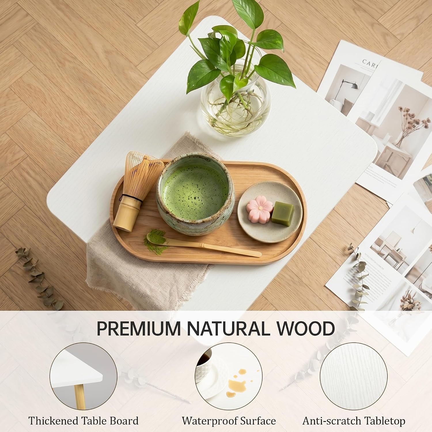 Top-down view of the white MDF tabletop with tea set and plant showing wood grain texture and rounded edges