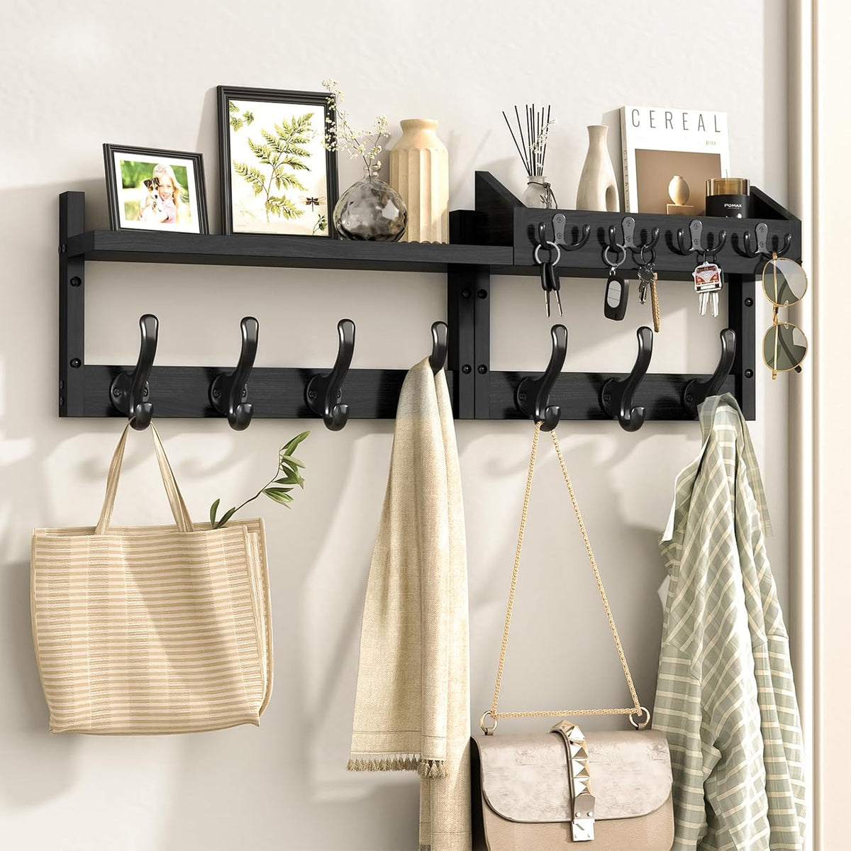 Black wall-mounted shelf rack with 11 black hooks holding bags, scarves and sunglasses.