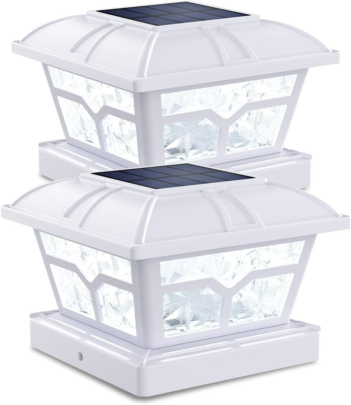 Two white post cap lights with clear faceted panels and solar panels on top.
