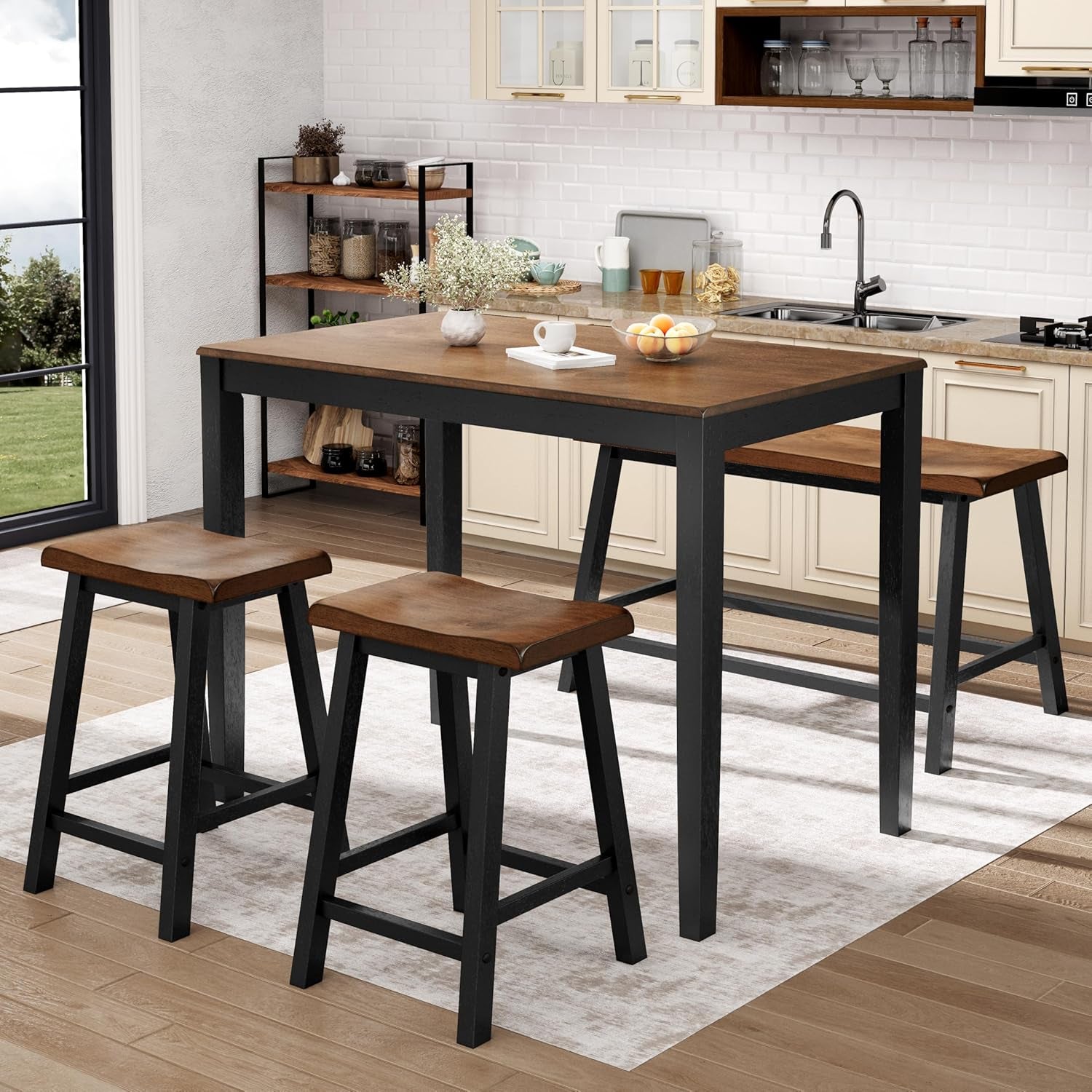Counter-height rectangular wood-top table with black legs, matching bench and two stools in a bright kitchen.