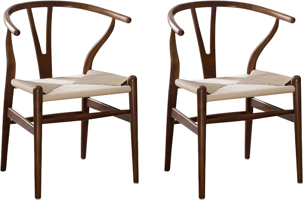 Pair of brown ash wood wishbone dining chairs shown from an angled side view.