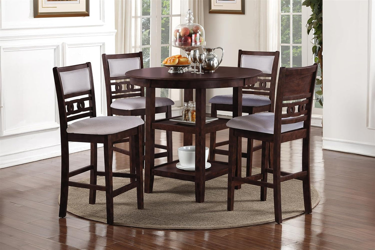 Round wood table and four chairs staged on a round rug in a bright dining room, front-right angle