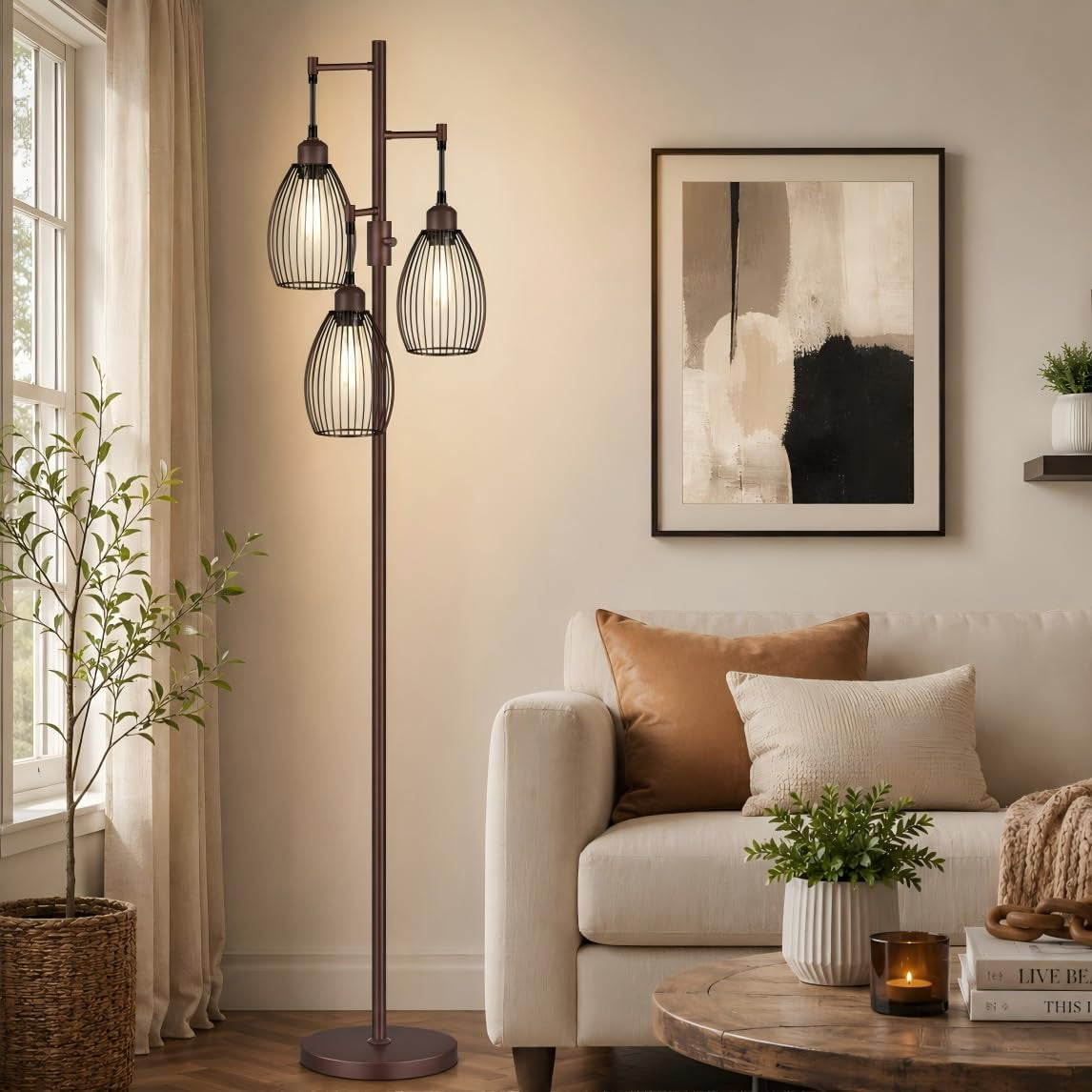 Tall three-arm floor lamp with teardrop wire cages beside a beige sofa in a warm living room.