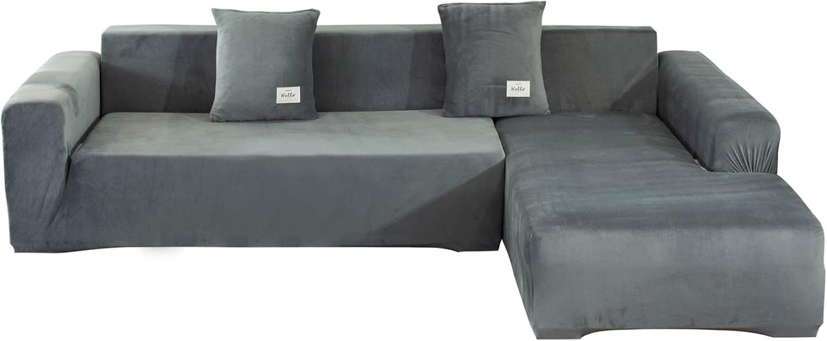 Slate gray velvet L-shaped slipcover front view showing chaise on the right and two matching pillows