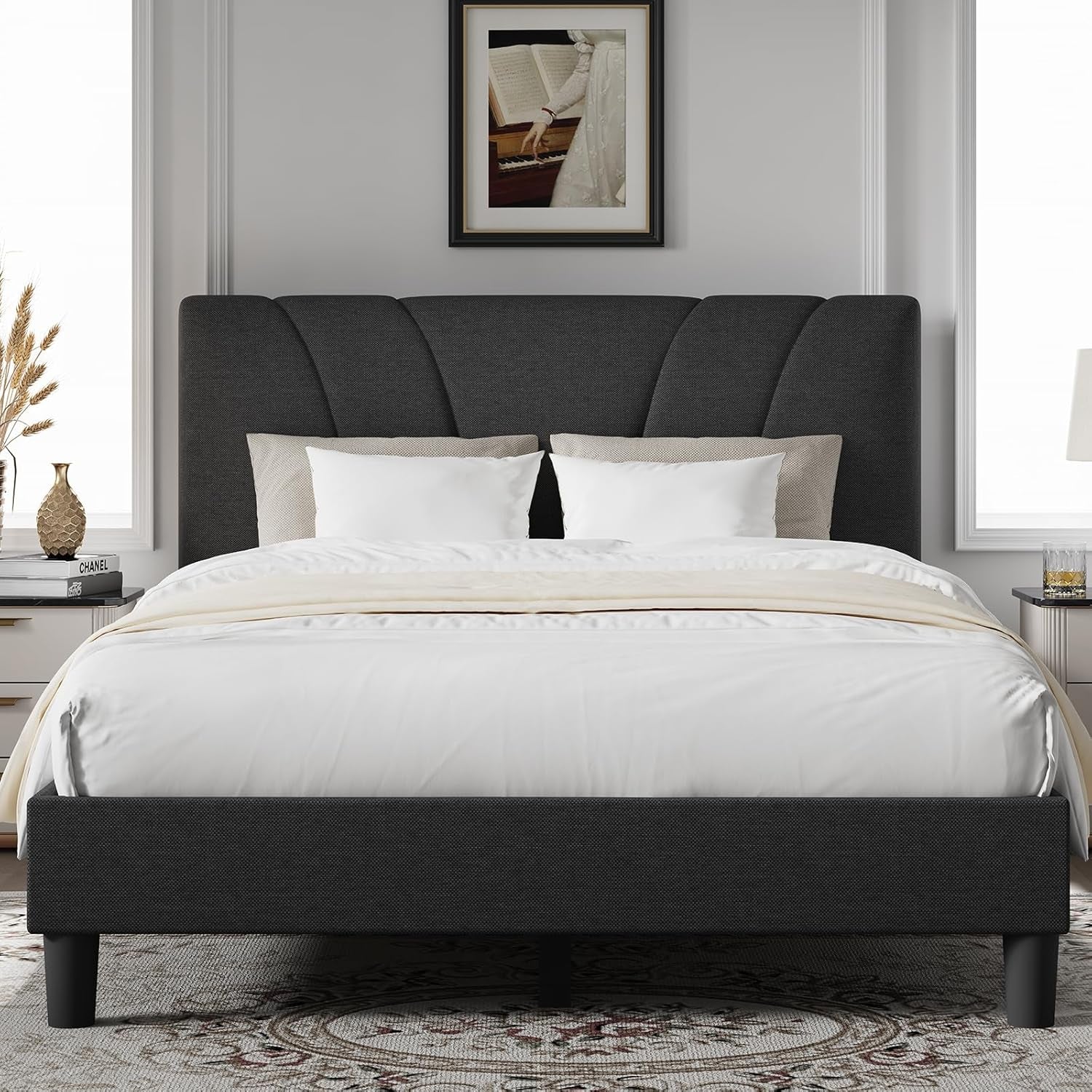 Centered close front view of the dark gray platform bed with a tall fan-panel headboard.