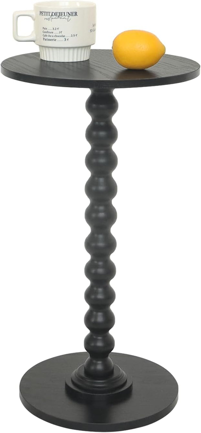 Black round side table with beaded spindle column, mug and lemon on top