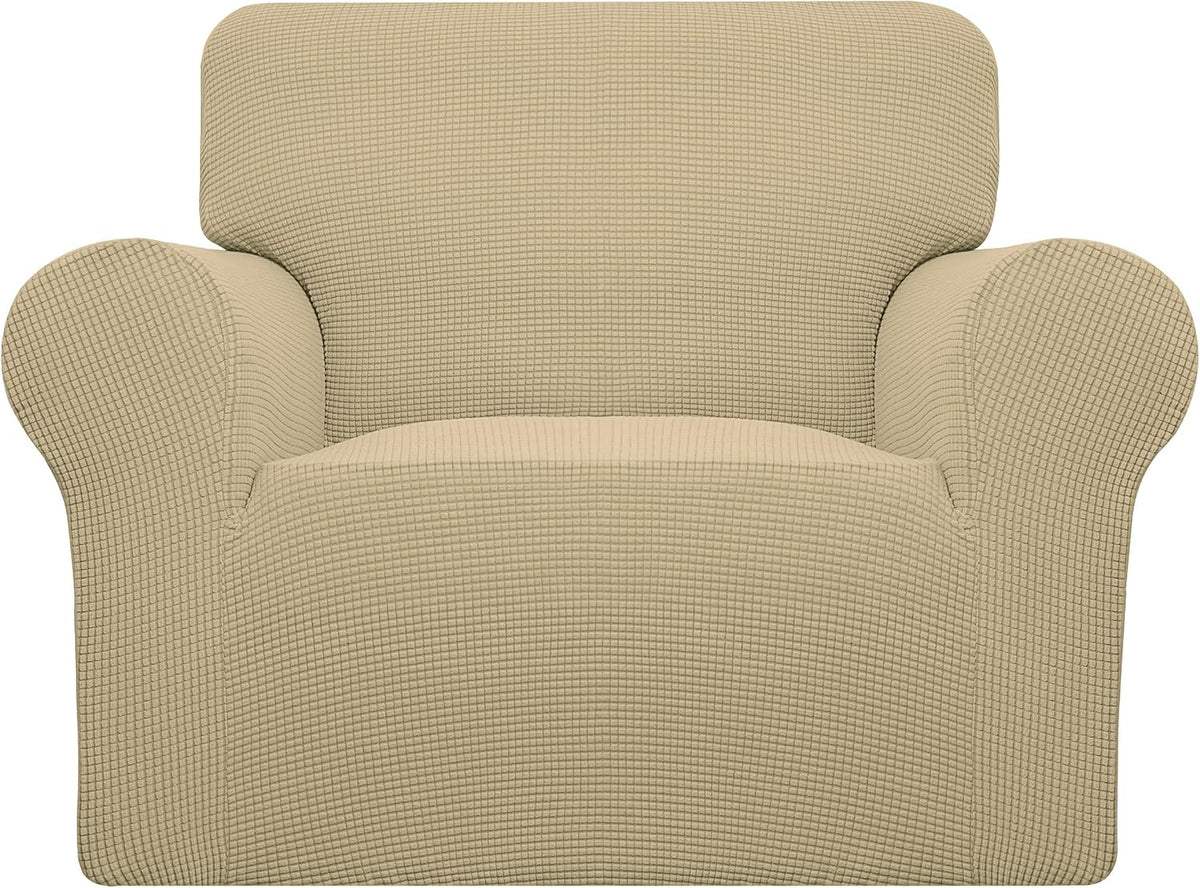 Tight front-facing crop of a beige armchair highlighting the rounded arms and waffle-like textured pattern.