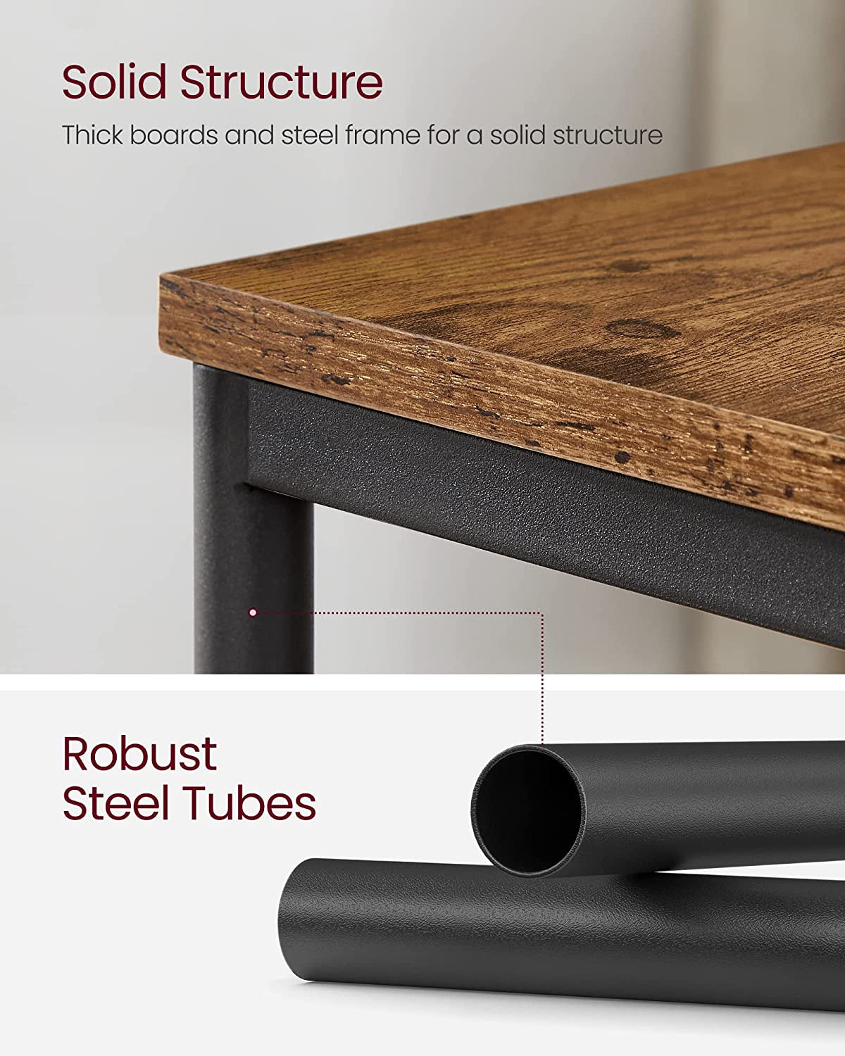 Close-up of the table top edge and textured black steel tube frame highlighting materials