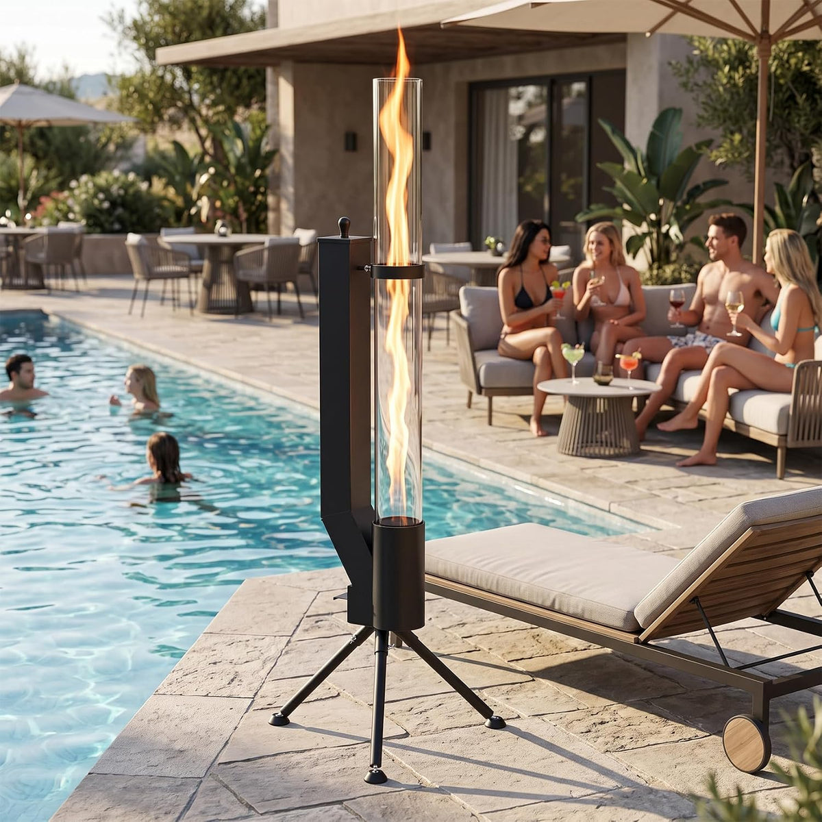 Tall glass-tube pellet heater on tripod beside a pool with people lounging and swimming in the background.