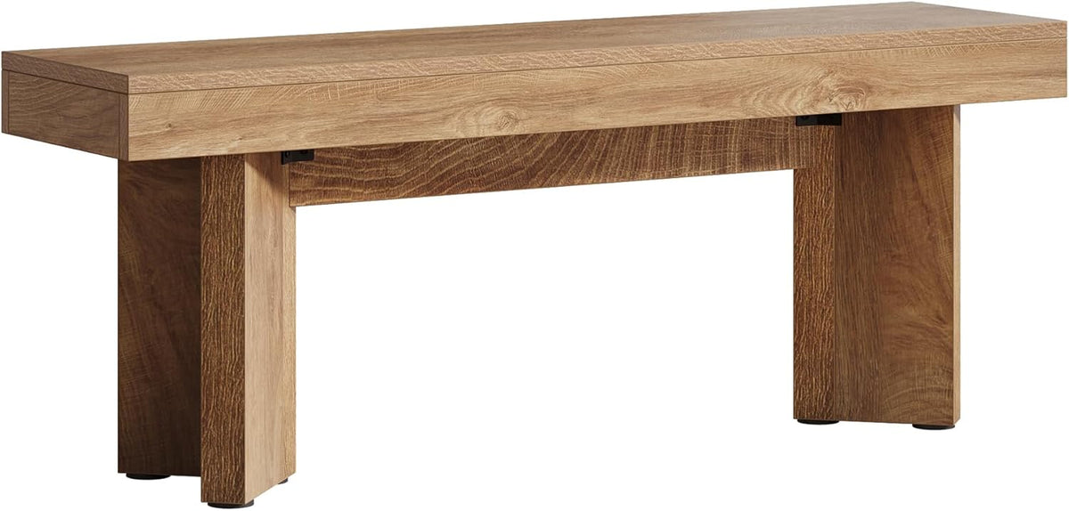 Studio shot of the bench on white background showing block legs and a continuous thick top from the front.