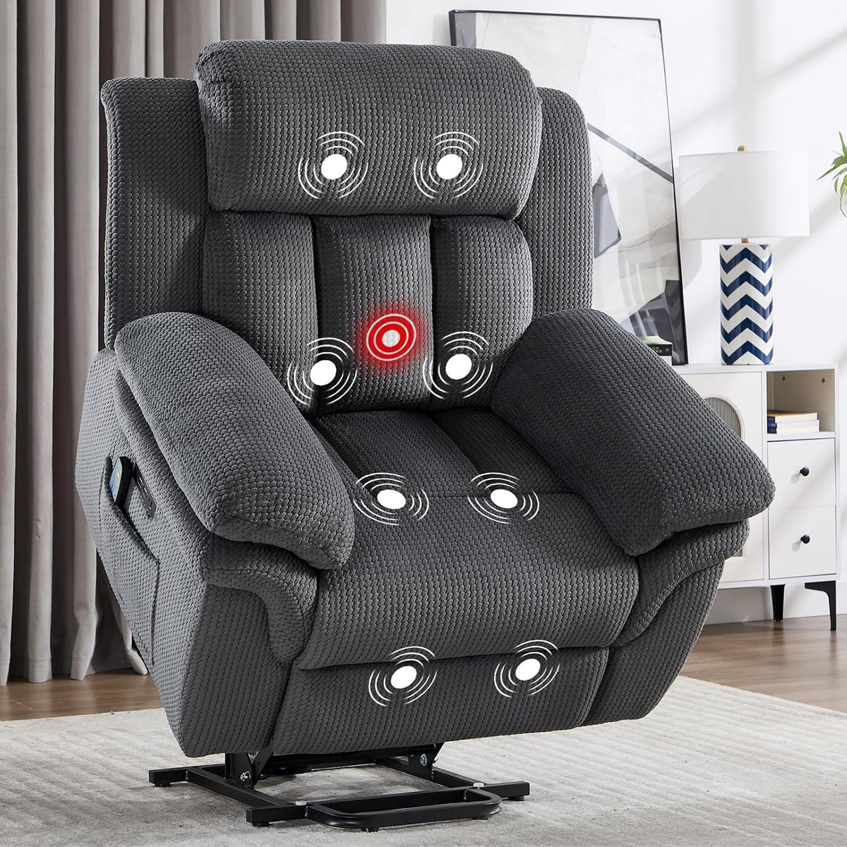 Close-up of a dark gray recliner seat showing vibration points marked on cushions