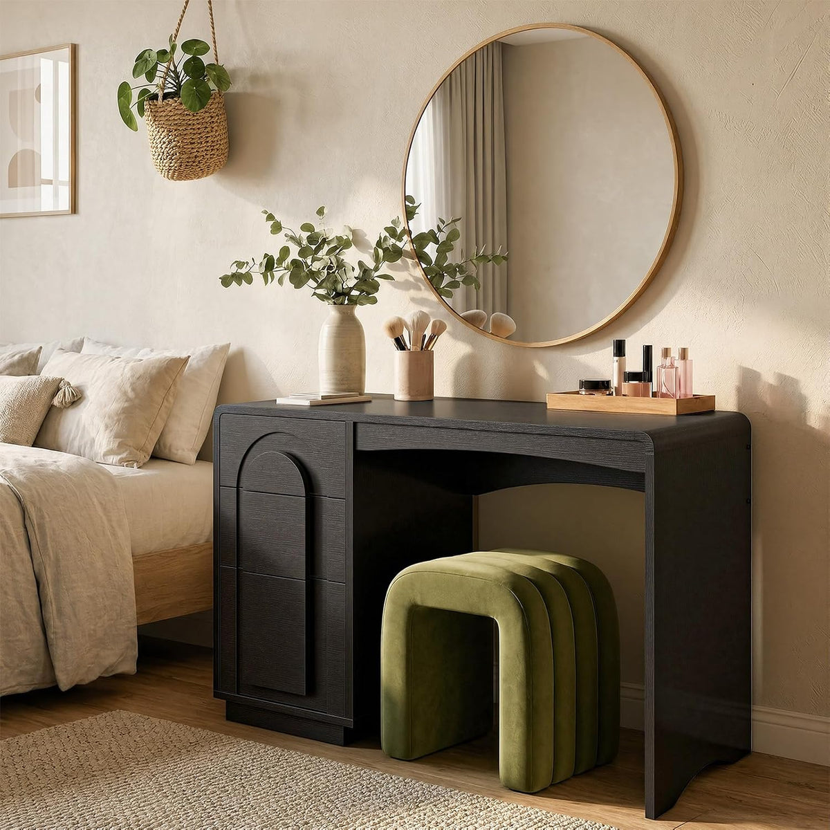 Black rounded-arch desk styled as a bedroom console with a round mirror and green upholstered stool