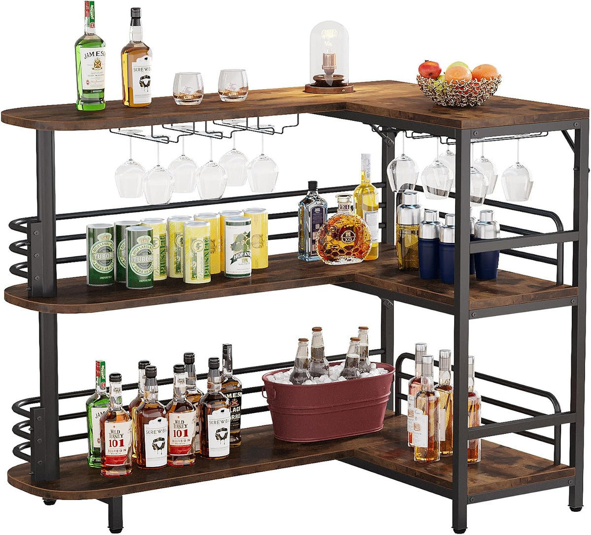 Fully stocked L-shaped bar with bottles, cans, an ice bucket, a lamp and a fruit bowl on the top surface.