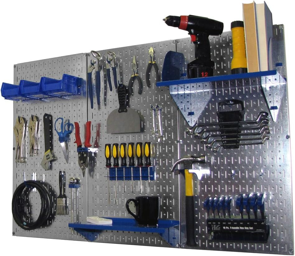 Silver metal pegboard showing tools, blue shelf, bins and mounted hammer and wrench set