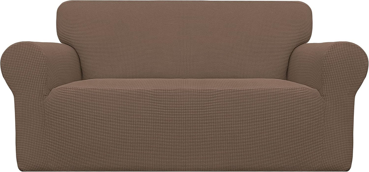 Front view of a loveseat with a brown waffle-texture stretch slipcover on a white background.