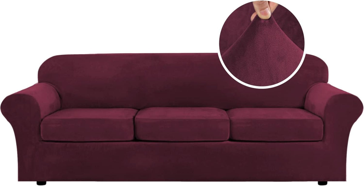 Front-facing three-seat sofa in deep burgundy, round inset shows a hand pinching the plush fabric.