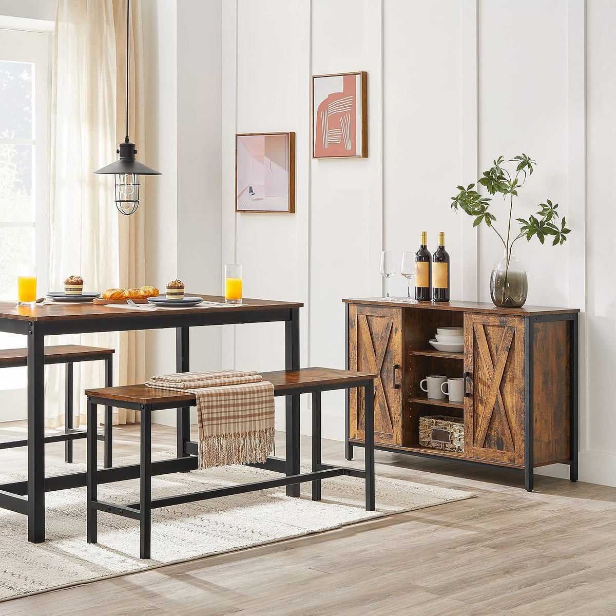 Rustic bench beside a dining table in a bright dining room setting with a coordinating storage cabinet in the background